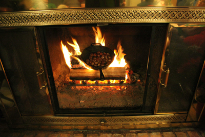 Photo of chestnuts roasting on an open fire